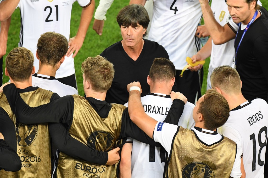 Germany's coach Joachim Loew (C) talks to his players before extra time during the Euro 2016 quarter-final football match between Germany and Italy at the Matmut Atlantique stadium in Bordeaux on July 2, 2016. / AFP / Mehdi FEDOUACH (Photo credit should read MEHDI FEDOUACH/AFP/Getty Images)