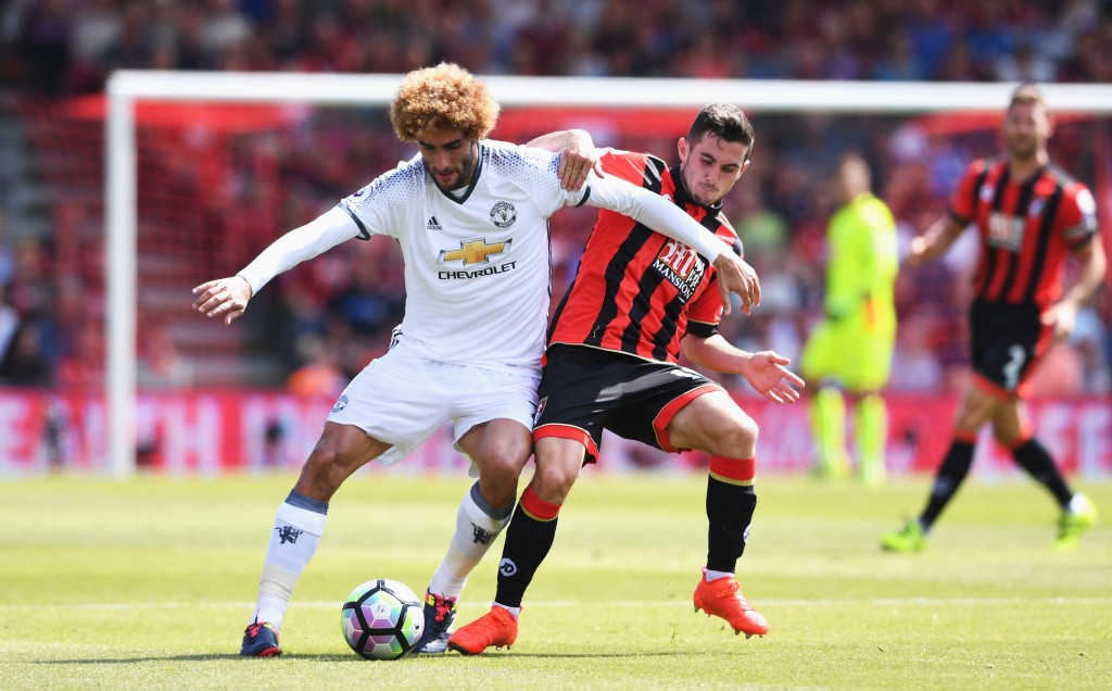 BOURNEMOUTH, ENGLAND - AUGUST 14: Marouane Fellaini of Manchester United is challenged by Lewis Cook of AFC Bournemouth during the Premier League match between AFC Bournemouth and Manchester United at Vitality Stadium on August 14, 2016 in Bournemouth, England. (Photo by Stu Forster/Getty Images)