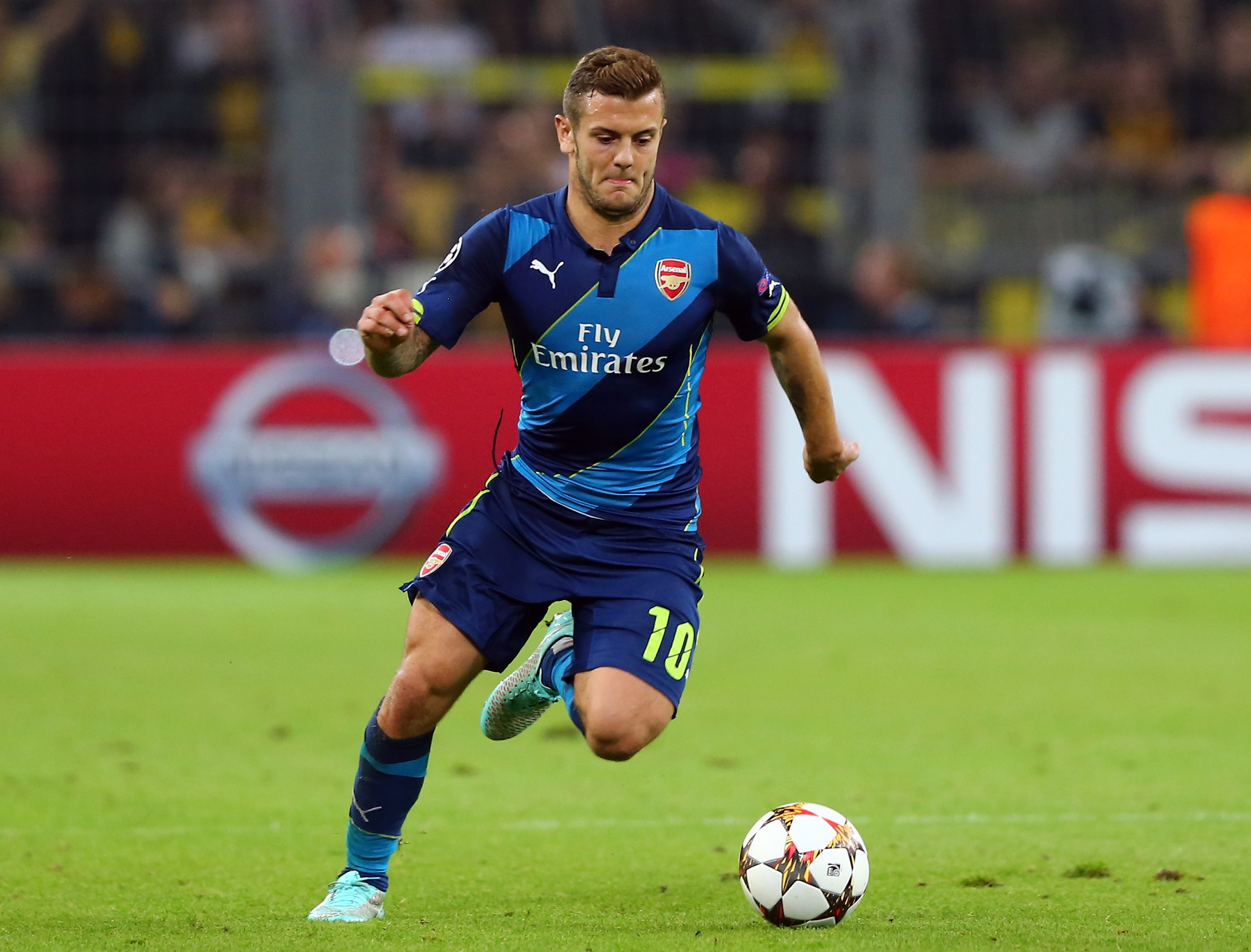 DORTMUND, GERMANY - SEPTEMBER 16: Jack Wilshere of Arsenal London runs with the ball the UEFA Champions League Group D match between Borussia Dortmund and Arsenal London at Signal Iduna Parkon September 16, 2014 in Dortmund, Germany. (Photo by Martin Rose/Bongarts/Getty Images)