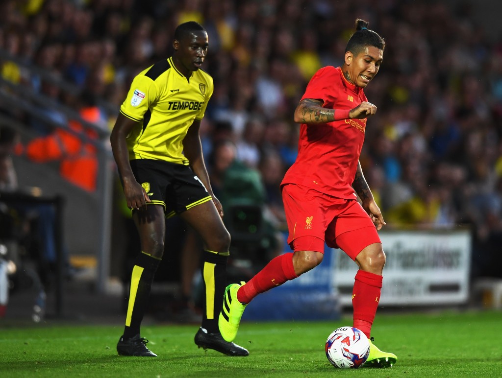 BURTON UPON TRENT, ENGLAND - AUGUST 23: Roberto Firmino of Liverpool goes past Lucas Akins of Burton Albion during the EFL Cup second round match between Burton Albion and Liverpool at Pirelli Stadium on August 23, 2016 in Burton upon Trent, England. (Photo by Gareth Copley/Getty Images)