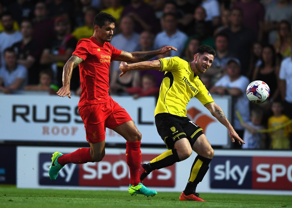 BURTON UPON TRENT, ENGLAND - AUGUST 23: Calum Butcher of Burton Albion is challenged by Dejan Lovren of Liverpool during the EFL Cup second round match between Burton Albion and Liverpool at Pirelli Stadium on August 23, 2016 in Burton upon Trent, England. (Photo by Gareth Copley/Getty Images)