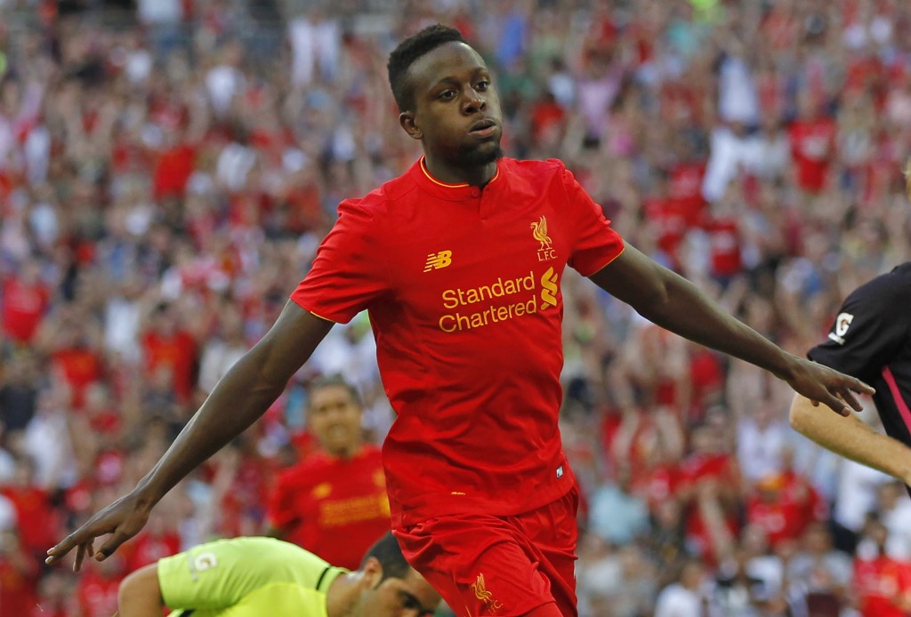 Liverpool's Belgian striker Divock Origi celebrates after scoring their third goal during the pre-season International Champions Cup football match between Spanish champions, Barcelona and Liverpool at Wembley stadium in London on August 6, 2016. / AFP / Ian KINGTON (Photo credit should read IAN KINGTON/AFP/Getty Images)