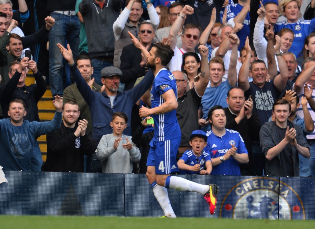 Chelsea's Spanish midfielder Cesc Fabregas celebrates after scoring a penalty during the English Premier League football match between Chelsea and Leicester City at Stamford Bridge in London on May 15, 2016. / AFP / GLYN KIRK / RESTRICTED TO EDITORIAL USE. No use with unauthorized audio, video, data, fixture lists, club/league logos or 'live' services. Online in-match use limited to 75 images, no video emulation. No use in betting, games or single club/league/player publications. / (Photo credit should read GLYN KIRK/AFP/Getty Images)