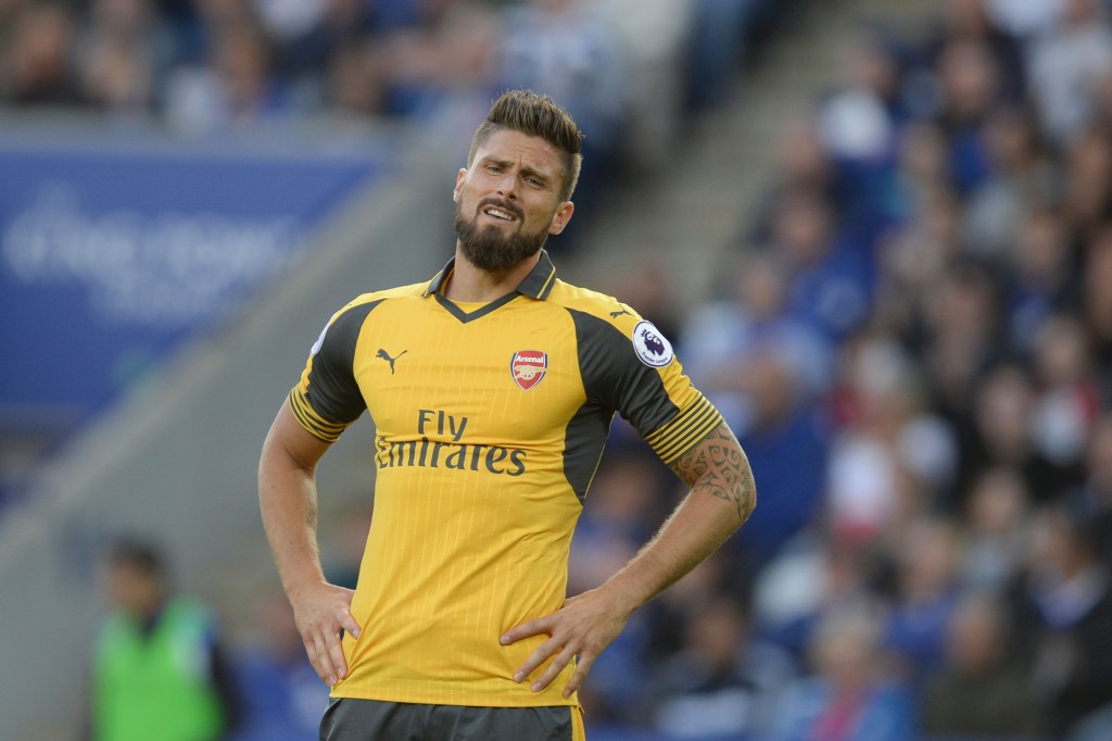 Arsenal's French striker Olivier Giroud reacts during the English Premier League football match between Leicester City and Arsenal at King Power Stadium in Leicester, central England on August 20, 2016. / AFP / OLI SCARFF / RESTRICTED TO EDITORIAL USE. No use with unauthorized audio, video, data, fixture lists, club/league logos or 'live' services. Online in-match use limited to 75 images, no video emulation. No use in betting, games or single club/league/player publications. / (Photo credit should read OLI SCARFF/AFP/Getty Images)