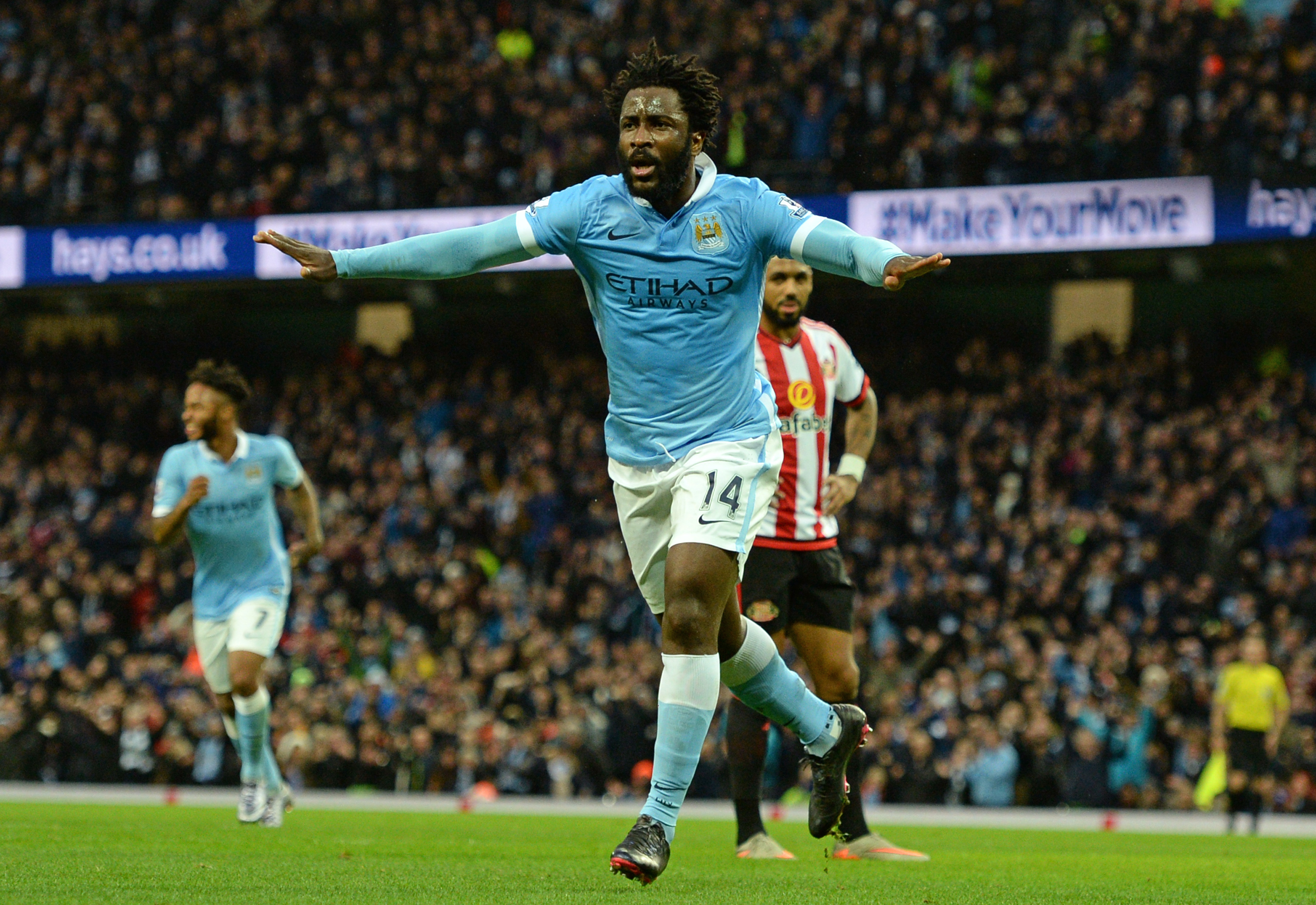 Manchester City's Ivorian striker Wilfried Bony celebrates scoring their third goal during the English Premier League football match between Manchester City and Sunderland at The Etihad stadium in Manchester, north west England on December 26, 2015. AFP PHOTO / OLI SCARFF RESTRICTED TO EDITORIAL USE. No use with unauthorized audio, video, data, fixture lists, club/league logos or 'live' services. Online in-match use limited to 75 images, no video emulation. No use in betting, games or single club/league/player publications. / AFP / OLI SCARFF (Photo credit should read OLI SCARFF/AFP/Getty Images)
