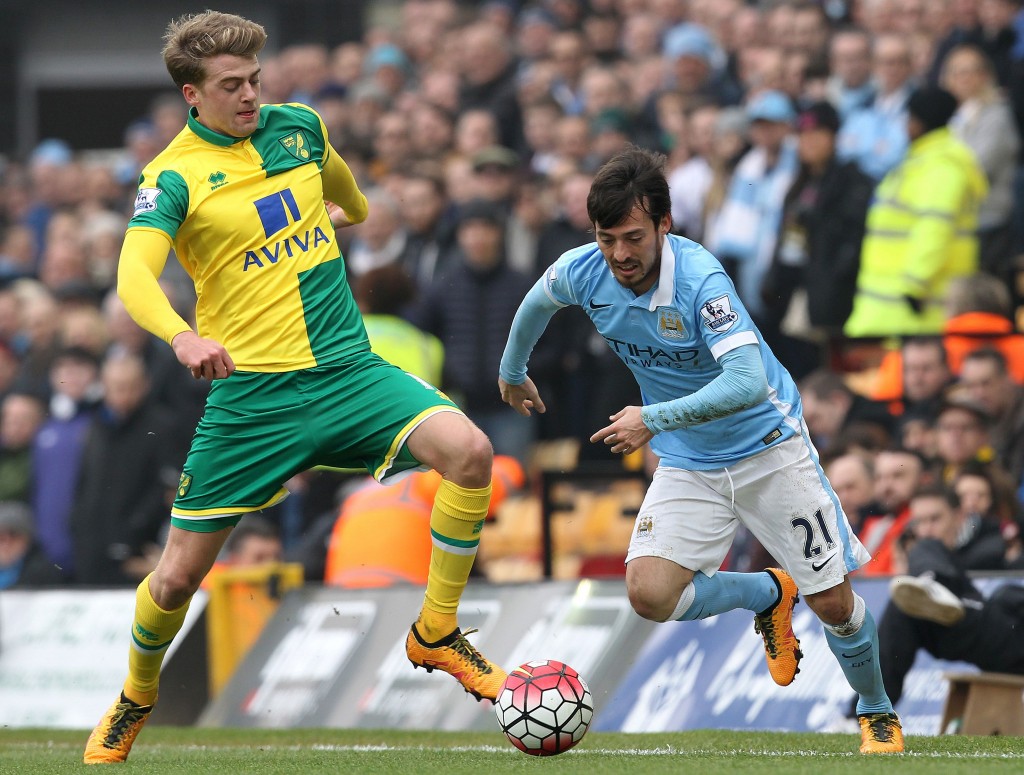 Norwich City's English striker Patrick Bamford (L) vies with Manchester City's Spanish midfielder David Silva during the English Premier League football match between Norwich City and Manchester City at Carrow Road in Norwich, eastern England, on March 12, 2016. / AFP / LINDSEY PARNABY (Photo credit should read LINDSEY PARNABY/AFP/Getty Images)