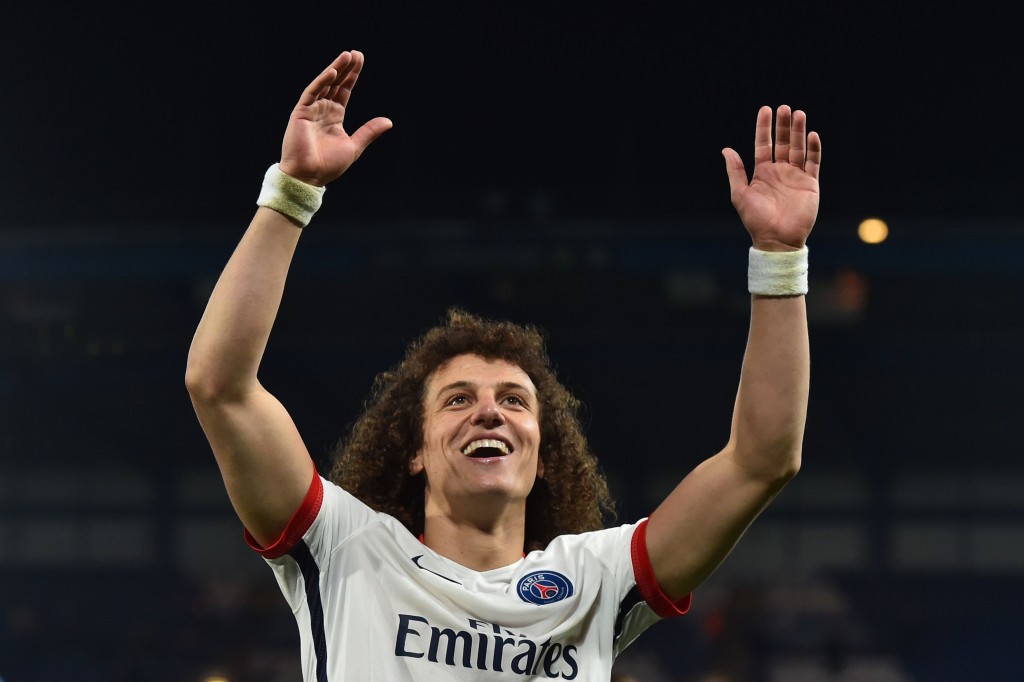 Paris Saint-Germain's Brazilian defender David Luiz waves to the crowd after his team won the UEFA Champions League round of 16 second leg football match between Chelsea and Paris Saint-Germain (PSG) at Stamford Bridge in London on March 9, 2016. / AFP / BEN STANSALL (Photo credit should read BEN STANSALL/AFP/Getty Images)