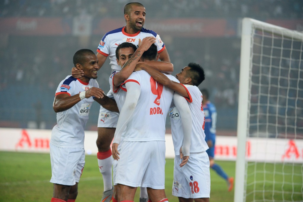 Delhi Dynamos FC forward Robin Singh (C) celebrates with teammates after scoring during the first leg of the semi-final football match between Delhi Dynamos FC and FC Goa of Indian Super League (ISL) at Jawahar Lal Nehru Stadium in New Delhi on December 11, 2015. AFP PHOTO / SAJJAD HUSSAIN / AFP / SAJJAD HUSSAIN (Photo credit should read SAJJAD HUSSAIN/AFP/Getty Images)