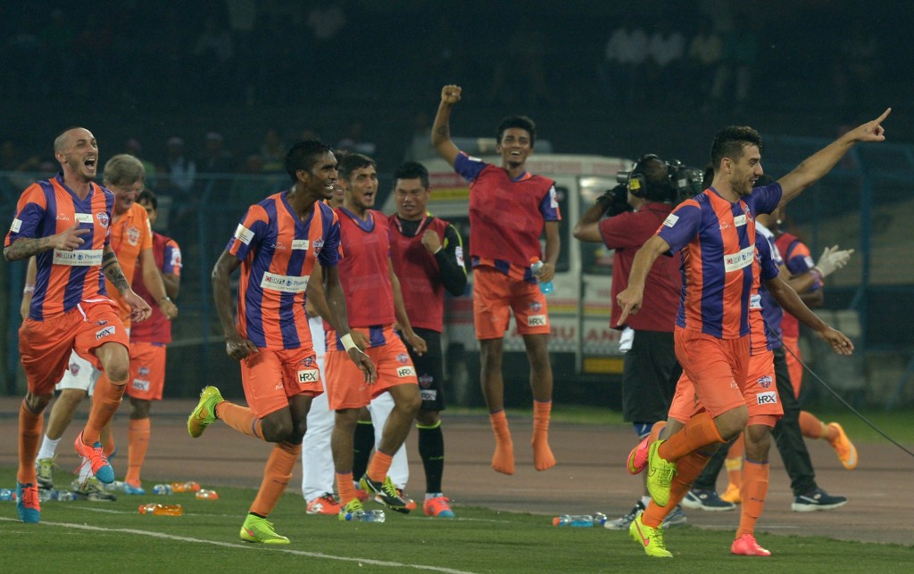 FC Pune City footballer Kostas Katsouranis (R) celebrates after scoring his team's second goal during the Indian Super League (ISL) football match between Atletico de Kolkata and FC Pune City at The Salt Lake Stadium in Kolkata on November 7, 2014. AFP PHOTO/Dibyangshu SARKAR (Photo credit should read DIBYANGSHU SARKAR/AFP/Getty Images)