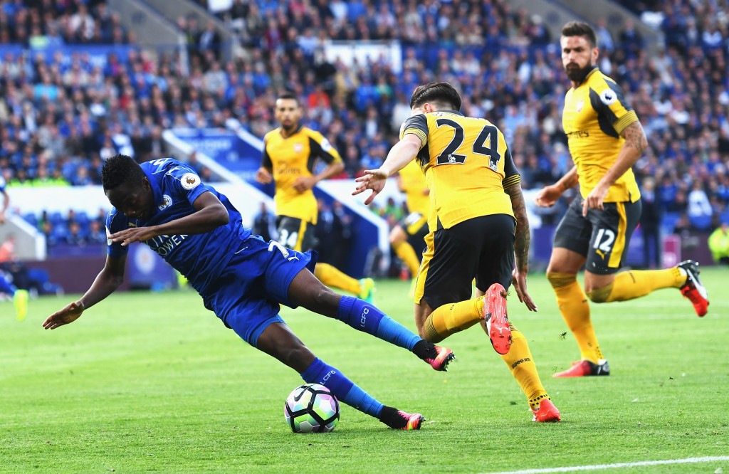 LEICESTER, ENGLAND - AUGUST 20: Ahmed Musa of Leicester City is taken down by Hector Bellerin of Arsenal during the Premier League match between Leicester City and Arsenal at The King Power Stadium on August 20, 2016 in Leicester, England. (Photo by Michael Regan/Getty Images)