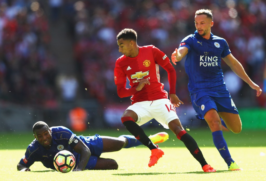 LONDON, ENGLAND - AUGUST 07: Jesse Lingard of Manchester United takes the ball past Wes Morgan of Leicester City and Daniel Drinkwater of Leicester City during The FA Community Shield match between Leicester City and Manchester United at Wembley Stadium on August 7, 2016 in London, England. (Photo by Michael Steele/Getty Images)