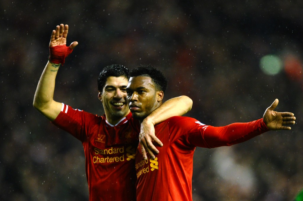LIVERPOOL, ENGLAND - JANUARY 28: Daniel Sturridge (R) of Liverpool is congratulated by teammate Luis Suarez (L) after scoring his team's third goal during the Barclays Premier League match between Liverpool and Everton at Anfield on January 28, 2014 in Liverpool, England. (Photo by Laurence Griffiths/Getty Images)
