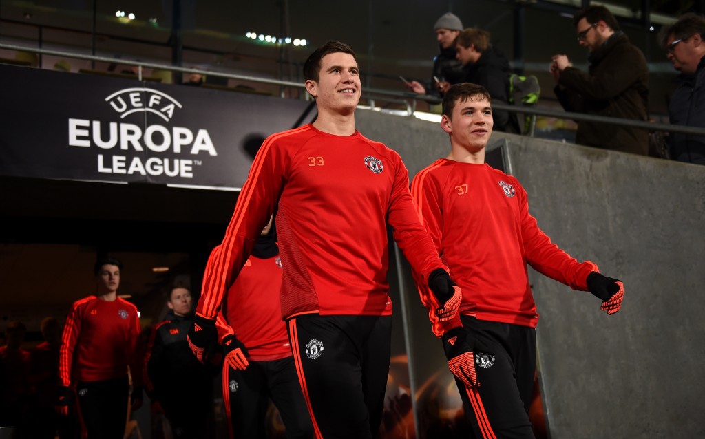 HERNING, DENMARK - FEBRUARY 17: Paddy McNair (c) and Donal Love of Manchester United make their way out onto the pitch during a training session ahead of the UEFA Europa League Round of 32 match between FC Midtjylland and Manchester United at Herning MCH Multi Arena on February 17, 2016 in Herning, Denmark. (Photo by Michael Regan/Getty Images)