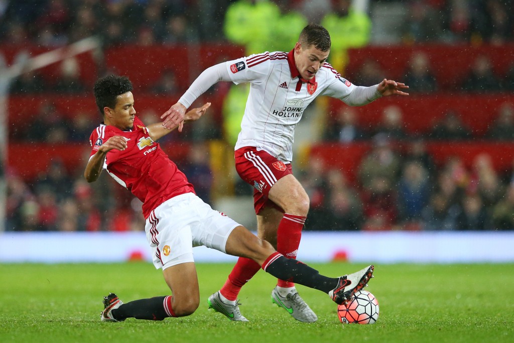 MANCHESTER, ENGLAND - JANUARY 09: Paul Coutts of Sheffield United is tackled by Cameron Borthwick-Jackson of Manchester United during the Emirates FA Cup Third Round match between Manchester United and Sheffield United at Old Trafford on January 9, 2016 in Manchester, England. (Photo by Alex Livesey/Getty Images)