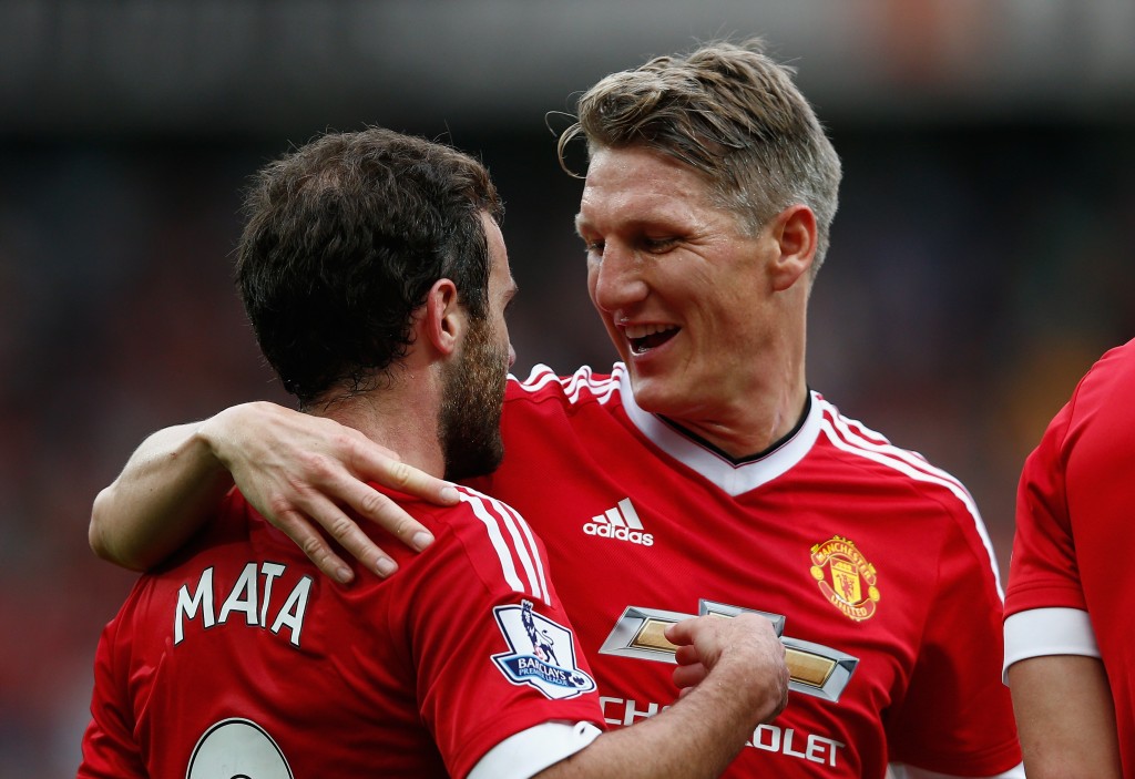 MANCHESTER, ENGLAND - SEPTEMBER 26: Juan Mata (L) of Manchester United celebrates scoring his team's third goal with his team mate Bastian Schweinsteiger (R) during the Barclays Premier League match between Manchester United and Sunderland at Old Trafford on September 26, 2015 in Manchester, United Kingdom. (Photo by Dean Mouhtaropoulos/Getty Images)