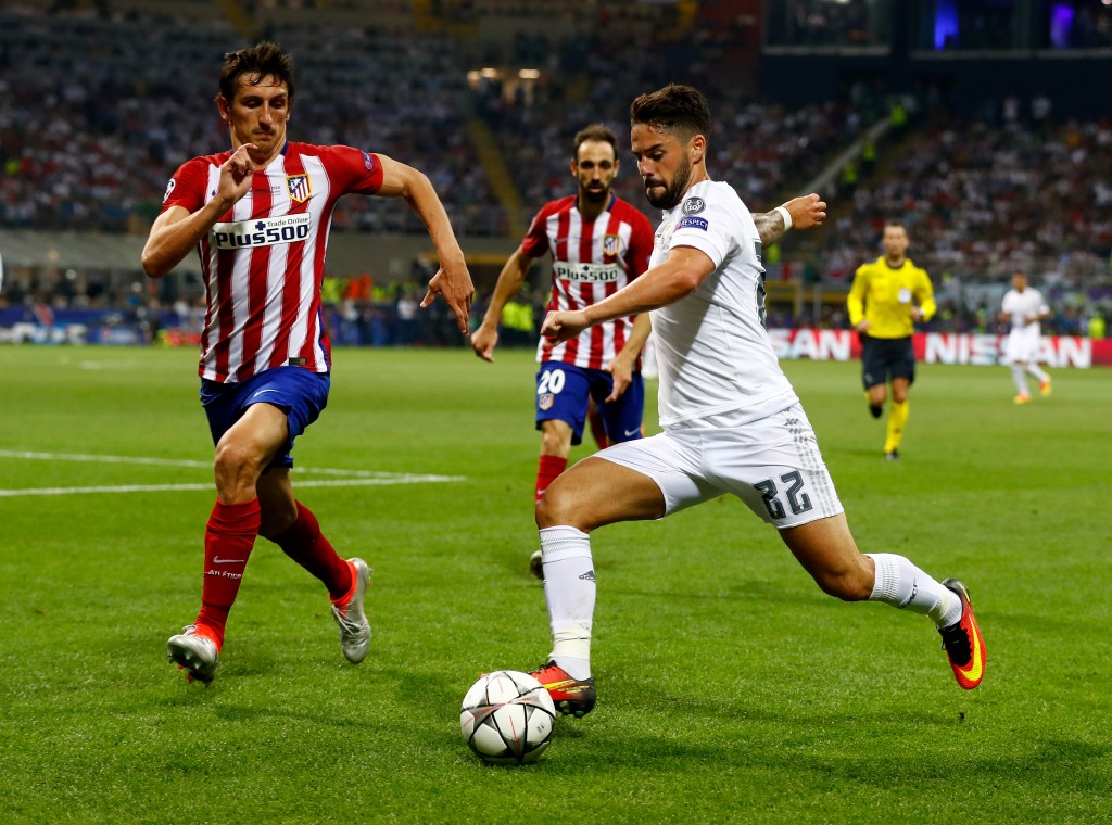 MILAN, ITALY - MAY 28: Isco of Real Madrid is challenged by Stefan Savic of Atletico Madrid during the UEFA Champions League Final match between Real Madrid and Club Atletico de Madrid at Stadio Giuseppe Meazza on May 28, 2016 in Milan, Italy. (Photo by Clive Rose/Getty Images)
