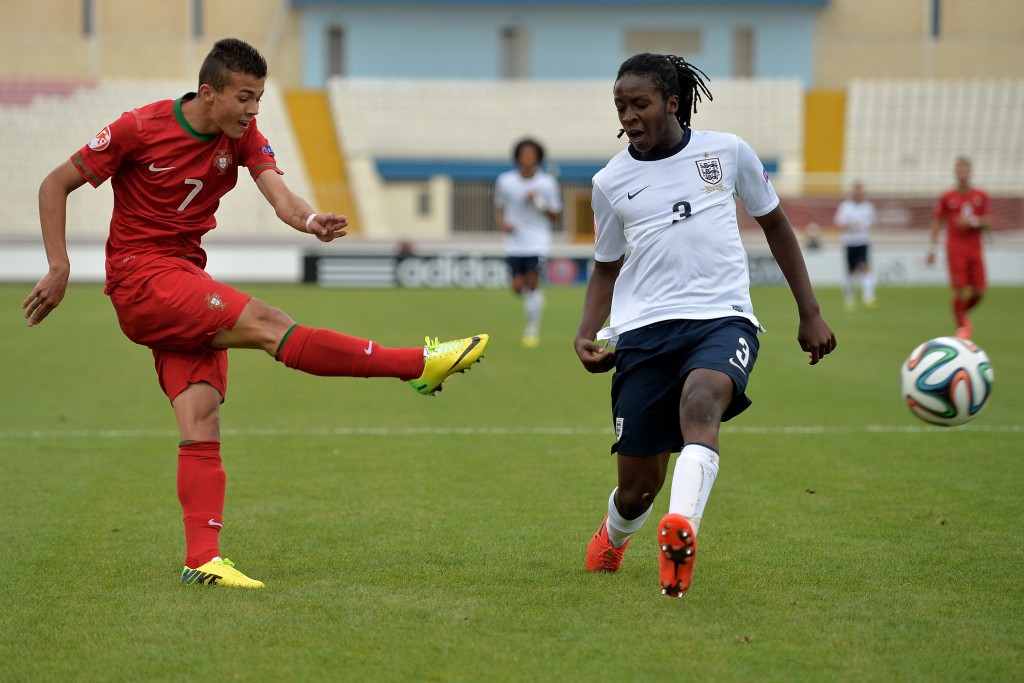 ATTARD, MALTA - MAY 18: (L-R) Diogo Goncalves of Portugal misses a chance at goal as Tafari Moore (R) of England tries to block during the UEFA Under17 European Championship 2014 semi final match between Portugal and England at Ta' Qali National Stadium on May 18, 2014 in Attard, Malta. (Photo by Sascha Steinbach/Bongarts/Getty Images)