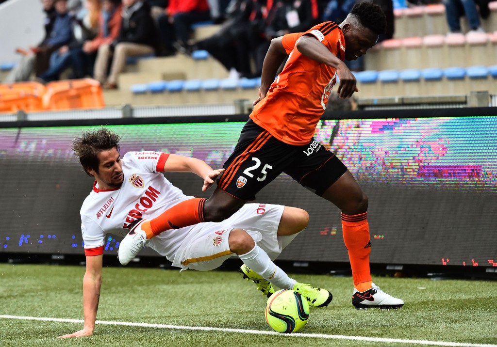 Monaco's Portuguese defender Fabio Coentrao (R) vies with Lorient's French Senegalese defender Lamine Gassama during the French L1 football match Lorient vs Monaco on January 17, 2016 at the Stade du Moustoir stadium in Lorient, western France.     AFP PHOTO / LOIC VENANCE / AFP / LOIC VENANCE        (Photo credit should read LOIC VENANCE/AFP/Getty Images)