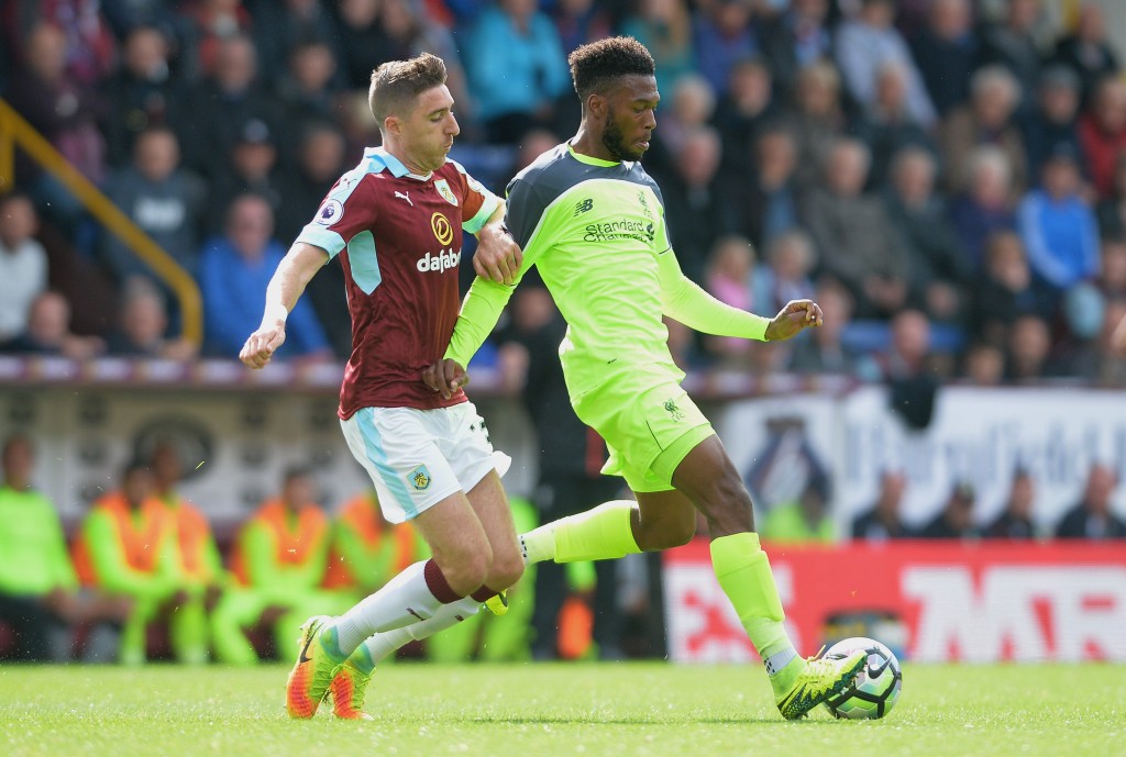 BURNLEY, ENGLAND - AUGUST 20: Daniel Sturridge of Liverpool and Stephen Ward of Burnley battle for possession during the Premier League match between Burnley and Liverpool at Turf Moor on August 20, 2016 in Burnley, England.  (Photo by Mark Runnacles/Getty Images)
