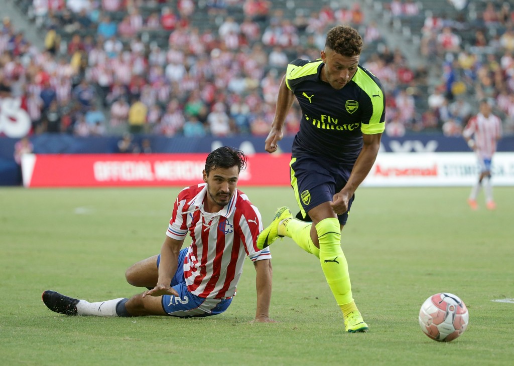 CARSON, CA - JULY 31: Alex Oxlade-Chamberlain #15 of Arsenal gets past Oswaldo Alanis #2 of Chivas de Guadalajara and scores a goal in the second half at StubHub Center on July 31, 2016 in Carson, California. Arsenal defeated Chivas de Guadalajara 3-1. (Photo by Jeff Gross/Getty Images)