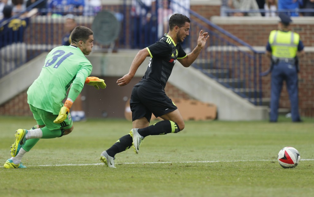 Chelsea midfielder Eden Hazard (R) dribbles past Real Madrid goalkeeper Ruben Yanez (L) to score a goal during an International Champions Cup soccer match in Ann Arbor, Michigan on July 30, 2016. / AFP / Jay LaPrete (Photo credit should read JAY LAPRETE/AFP/Getty Images)