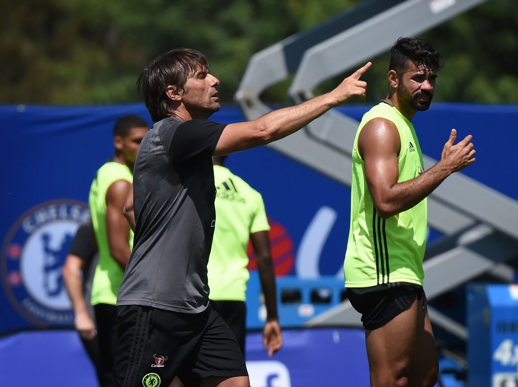 New Chelsea coach Antonio Conte (L) and striker Diego Costa (R) during a training session before their International Champions Cup (ICC) game against Liverpool, at the UCLA Campus in Westwood, California on July 26, 2016. The two teams will meet at the Rose Bowl on July 27, 2016. / AFP / Mark Ralston (Photo credit should read MARK RALSTON/AFP/Getty Images)