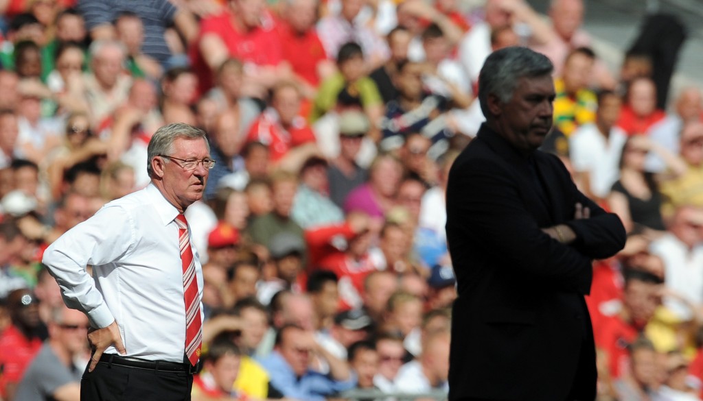 Manchester United's Manager Sir Alex Ferguson (L) looks on from the touchline from behind Chelsea's Manager Carlo Ancelotti (R) during the FA Community Shield football match at Wembley Stadium in London on August 8, 2010. Manchester United won the game 3-1. AFP PHOTO / ADRIAN DENNIS RESTRICTED FOR EDITORIAL USE/NO COMMERCIAL USE (Photo credit should read ADRIAN DENNIS/AFP/Getty Images)