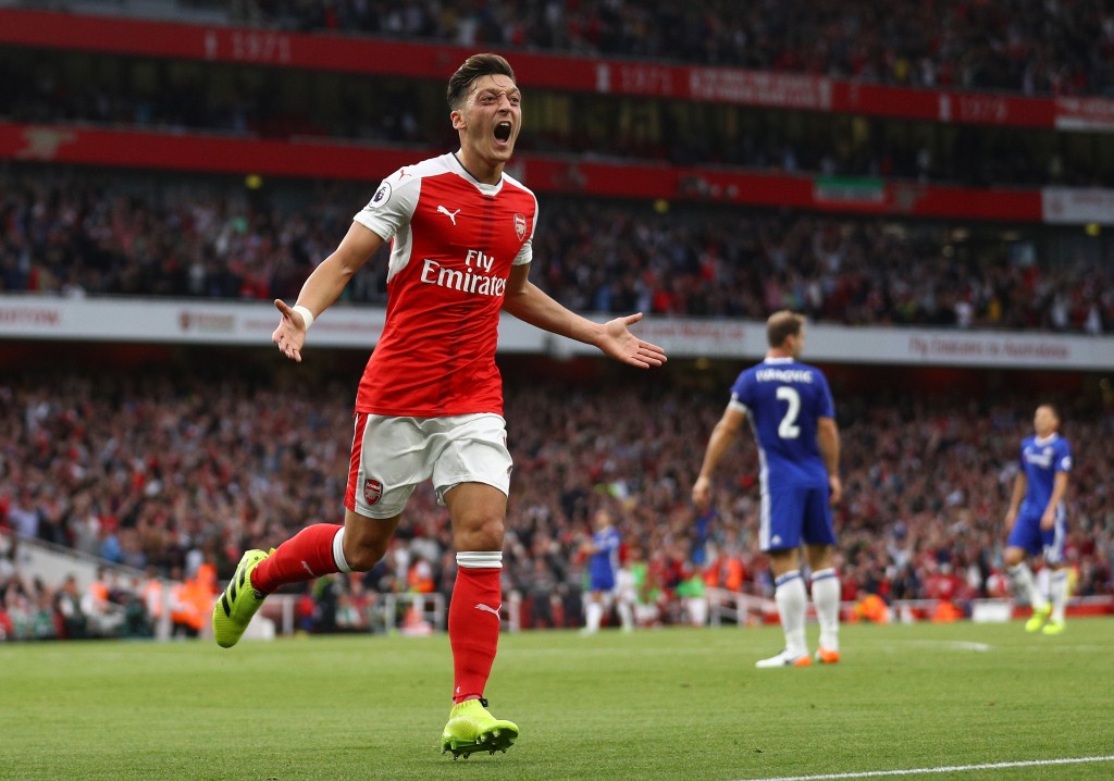 LONDON, ENGLAND - SEPTEMBER 24: Mesut Ozil of Arsenal celebrates scoring his sides third goal during the Premier League match between Arsenal and Chelsea at the Emirates Stadium on September 24, 2016 in London, England. (Photo by Paul Gilham/Getty Images)
