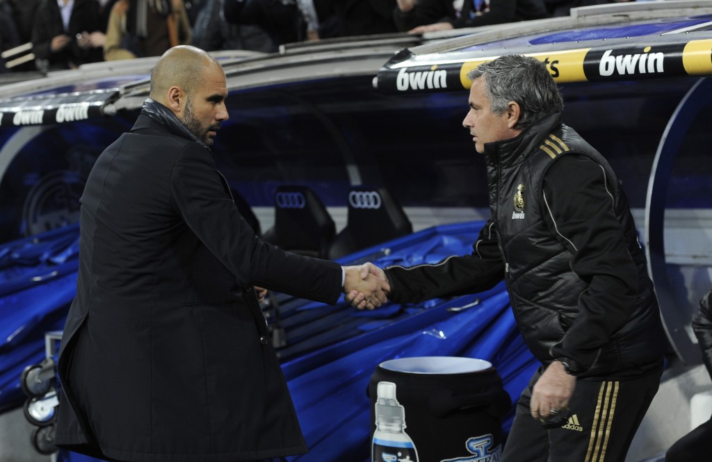 Barcelona's coach Josep Guardiola (L) and Real Madrid's coach Jose Mourinho shake hand before the Spanish Cup "El clasico" football match Real Madrid vs Barcelona at the Santiago Bernabeu stadium in Madrid on January 18, 2011. AFP PHOTO/ DANI POZO (Photo credit should read DANI POZO/AFP/Getty Images)