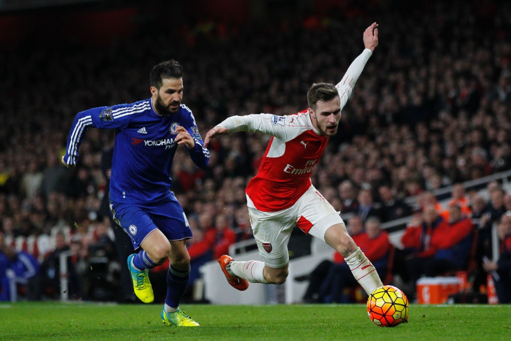 Chelsea's Spanish midfielder Cesc Fabregas (L) vies with Arsenal's Welsh midfielder Aaron Ramsey during the English Premier League football match between Arsenal and Chelsea at the Emirates Stadium in London on January 24, 2016. AFP PHOTO / IKIMAGES Could Ramsey return to England to join Chelsea, like former Arsenal captain Cesc Fabregas once did? (Photo by IKIMAGES/AFP/Getty Images)