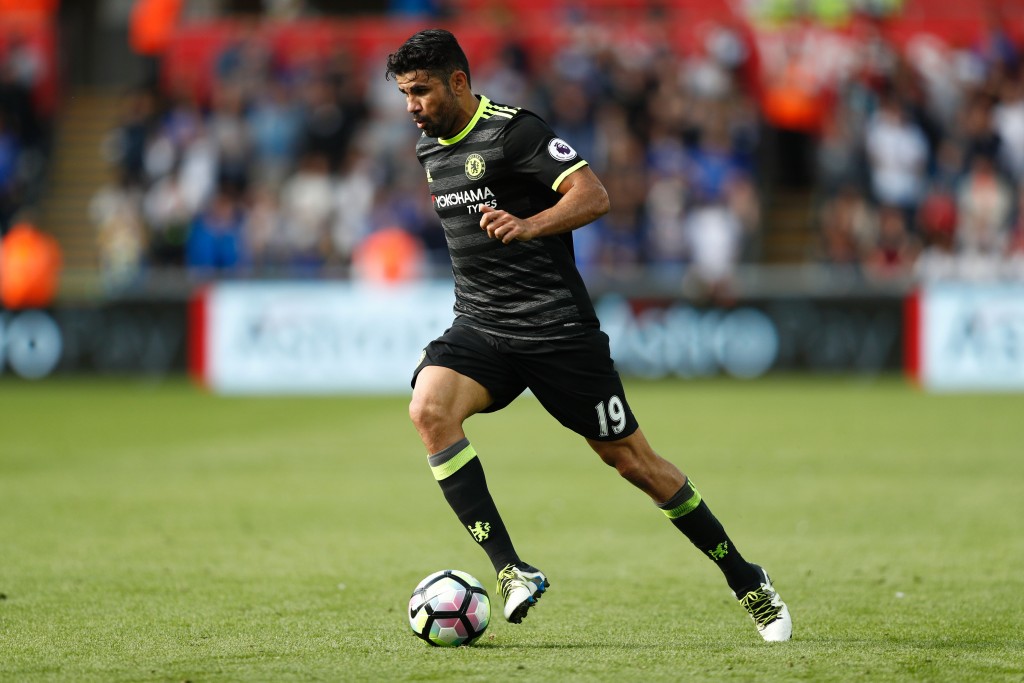 Chelsea's Brazilian-born Spanish striker Diego Costa runs with the ball during the English Premier League football match between Swansea City and Chelsea at The Liberty Stadium in Swansea, south Wales on September 11, 2016. / AFP / Adrian DENNIS / RESTRICTED TO EDITORIAL USE. No use with unauthorized audio, video, data, fixture lists, club/league logos or 'live' services. Online in-match use limited to 75 images, no video emulation. No use in betting, games or single club/league/player publications. / (Photo credit should read ADRIAN DENNIS/AFP/Getty Images)