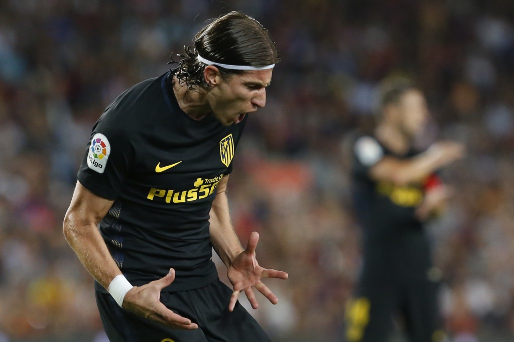 Atletico Madrid's Brazilian defender Filipe Luis shouts after missing a goal opportunity during the Spanish league football match FC Barcelona vs Atletico de Madrid at the Camp Nou stadium in Barcelona on September 21, 2016. / AFP / PAU BARRENA (Photo credit should read PAU BARRENA/AFP/Getty Images)