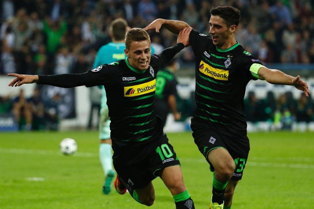 Moenchengladbach's Belgian midfielder Thorgan Hazard (L) celebrates after scoring the opening goal with Moenchengladbach's forward Lars Stindl during the UEFA Champions League first-leg group C football match between Borussia Moenchengladbach and FC Barcelona at the Borussia Park in Moenchengladbach, western Germany on September 28, 2016. / AFP / Odd ANDERSEN (Photo credit should read ODD ANDERSEN/AFP/Getty Images)