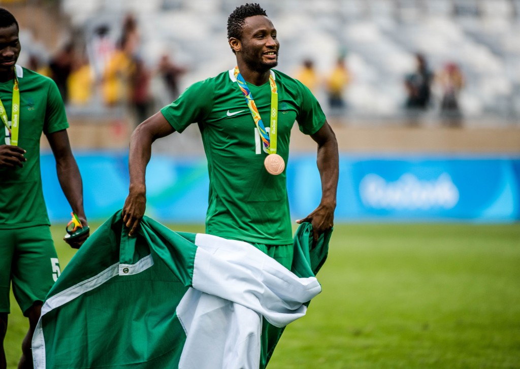 Nigeria's John Obi Mikel celebrates after receiving the bronze medal during the medal ceremony after defeating Honduras in the Rio 2016 Olympic Games men's bronze medal football match at the Mineirao stadium in Belo Horizonte, Brazil, on August 20, 2016. (Photo by Gustavo Andrade/AFP/Getty Images)