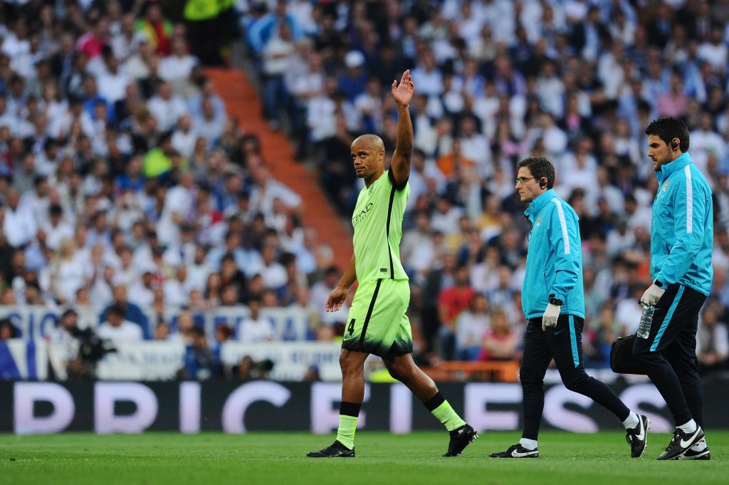 MADRID, SPAIN - MAY 04: Vincent Kompany of Manchester City leaves the field after suffering from an injury during the UEFA Champions League semi final, second leg match between Real Madrid and Manchester City FC at Estadio Santiago Bernabeu on May 4, 2016 in Madrid, Spain. (Photo by David Ramos/Getty Images )