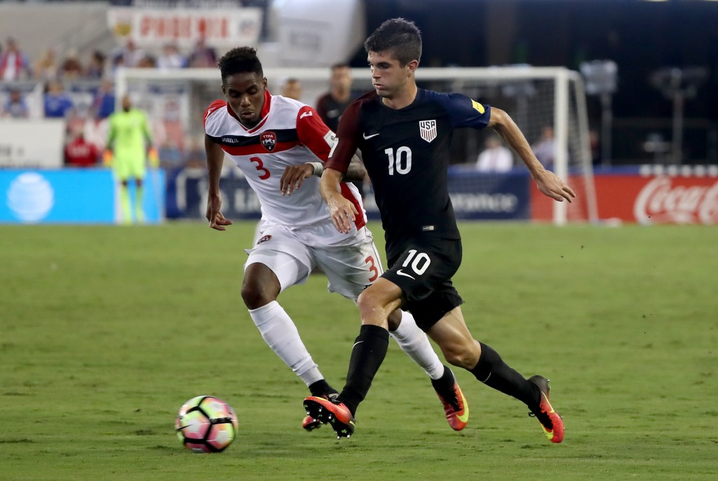 JACKSONVILLE, FL - SEPTEMBER 06: Christian Pulisic #10 of the United States drives past Joevin Jones #3 of Trinidad & Tobago during the FIFA 2018 World Cup Qualifier at EverBank Field on September 6, 2016 in Jacksonville, Florida. (Photo by Sam Greenwood/Getty Images)