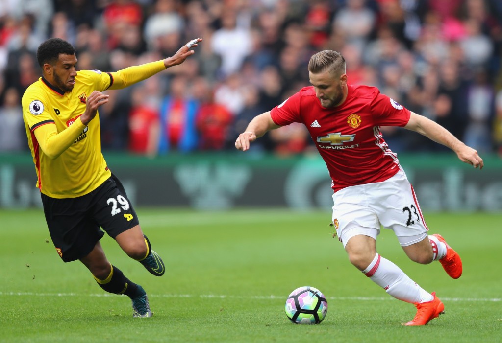 WATFORD, ENGLAND - SEPTEMBER 18: Luke Shaw of Manchester United (R) takes the ball past Etienne Capoue of Watford (L) during the Premier League match between Watford and Manchester United at Vicarage Road on September 18, 2016 in Watford, England. (Photo by Richard Heathcote/Getty Images)