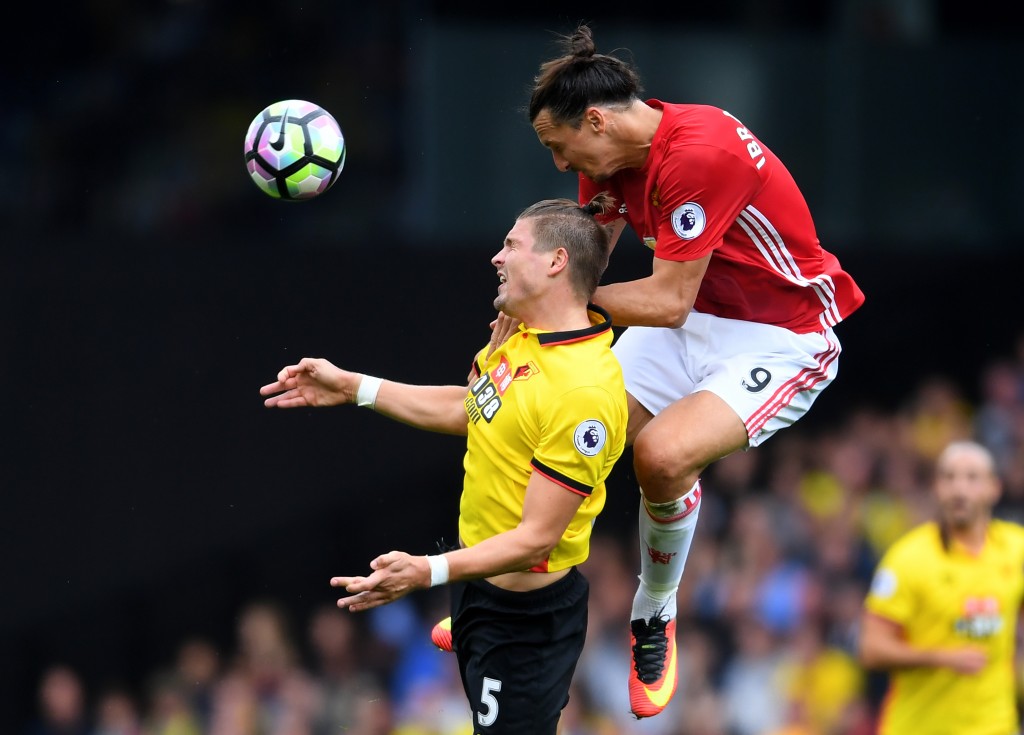 WATFORD, ENGLAND - SEPTEMBER 18: Zlatan Ibrahimovic of Manchester United (R) and Sebastian Prodl of Watford (L) battle for possession in the air during the Premier League match between Watford and Manchester United at Vicarage Road on September 18, 2016 in Watford, England. (Photo by Laurence Griffiths/Getty Images)