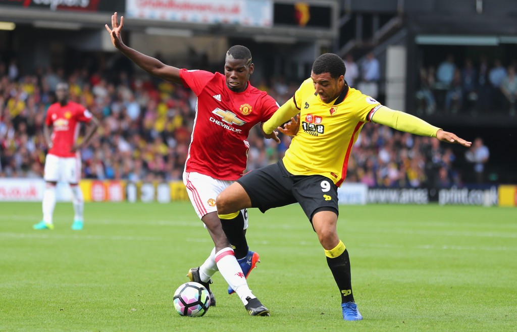 WATFORD, ENGLAND - SEPTEMBER 18: Paul Pogba of Manchester United (L) and Troy Deeney of Watford (R) battle for possession during the Premier League match between Watford and Manchester United at Vicarage Road on September 18, 2016 in Watford, England. (Photo by Richard Heathcote/Getty Images)