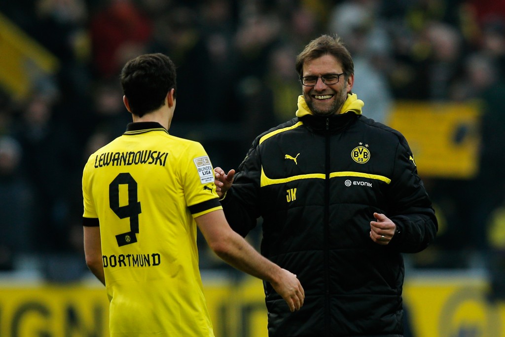 DORTMUND, GERMANY - MARCH 02: Robert Lewandowski (#9) of Dortmund celebrates with Borussia Dortmund manager, Jurgen Klopp after victory in the Bundesliga match between Borussia Dortmund and Hannover 96 at Signal Iduna Park on March 2, 2013 in Dortmund, Germany. (Photo by Dean Mouhtaropoulos/Bongarts/Getty Images)
