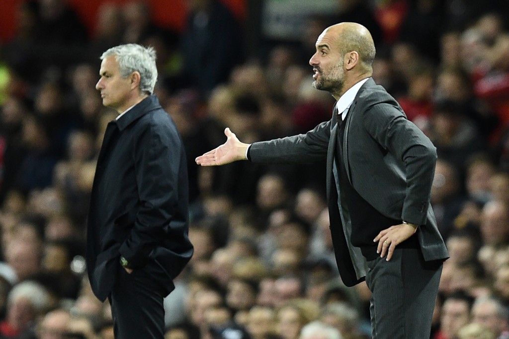 Manchester City's Spanish manager Pep Guardiola (R) gestures on the touchline during the EFL (English Football League) Cup fourth round match between Manchester United and Manchester City at Old Trafford in Manchester, north west England on October 26, 2016. Manchester United won the game 1-0. / AFP / Oli SCARFF / RESTRICTED TO EDITORIAL USE. No use with unauthorized audio, video, data, fixture lists, club/league logos or 'live' services. Online in-match use limited to 75 images, no video emulation. No use in betting, games or single club/league/player publications. / (Photo credit should read OLI SCARFF/AFP/Getty Images)