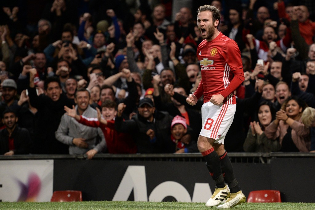 Manchester United's Spanish midfielder Juan Mata celebrates after scoring the opening goal of the EFL (English Football League) Cup fourth round match between Manchester United and Manchester City at Old Trafford in Manchester, north west England on October 26, 2016. / AFP / Oli SCARFF / RESTRICTED TO EDITORIAL USE. No use with unauthorized audio, video, data, fixture lists, club/league logos or 'live' services. Online in-match use limited to 75 images, no video emulation. No use in betting, games or single club/league/player publications. / (Photo credit should read OLI SCARFF/AFP/Getty Images)