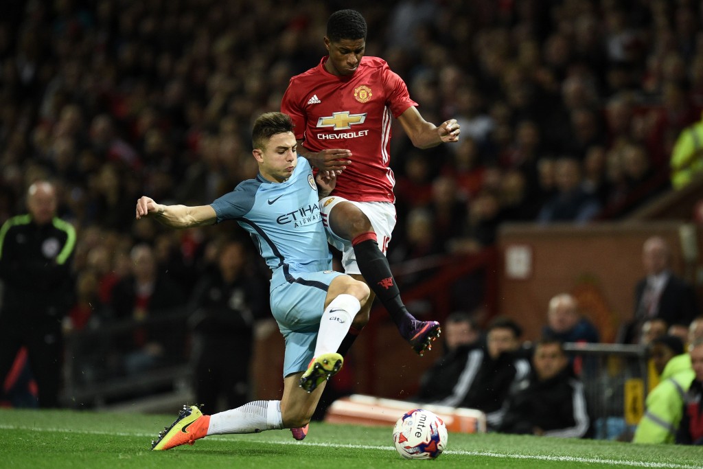 Manchester City's Spanish defender Pablo Maffeo (L) vies with Manchester United's English striker Marcus Rashford during the EFL (English Football League) Cup fourth round match between Manchester United and Manchester City at Old Trafford in Manchester, north west England on October 26, 2016. / AFP / Oli SCARFF / RESTRICTED TO EDITORIAL USE. No use with unauthorized audio, video, data, fixture lists, club/league logos or 'live' services. Online in-match use limited to 75 images, no video emulation. No use in betting, games or single club/league/player publications. / (Photo credit should read OLI SCARFF/AFP/Getty Images)