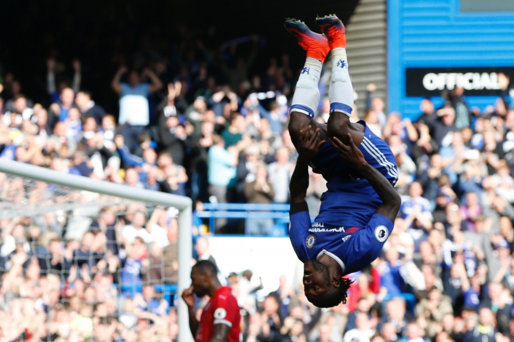 Chelsea's Nigerian midfielder Victor Moses (R) celebrates after scoring their third goal during the English Premier League football match between Chelsea and Leicester City at Stamford Bridge in London on October 15, 2016. Chelsea won the game 3-0. (Photo by Adrian Dennis/AFP/Getty Images)