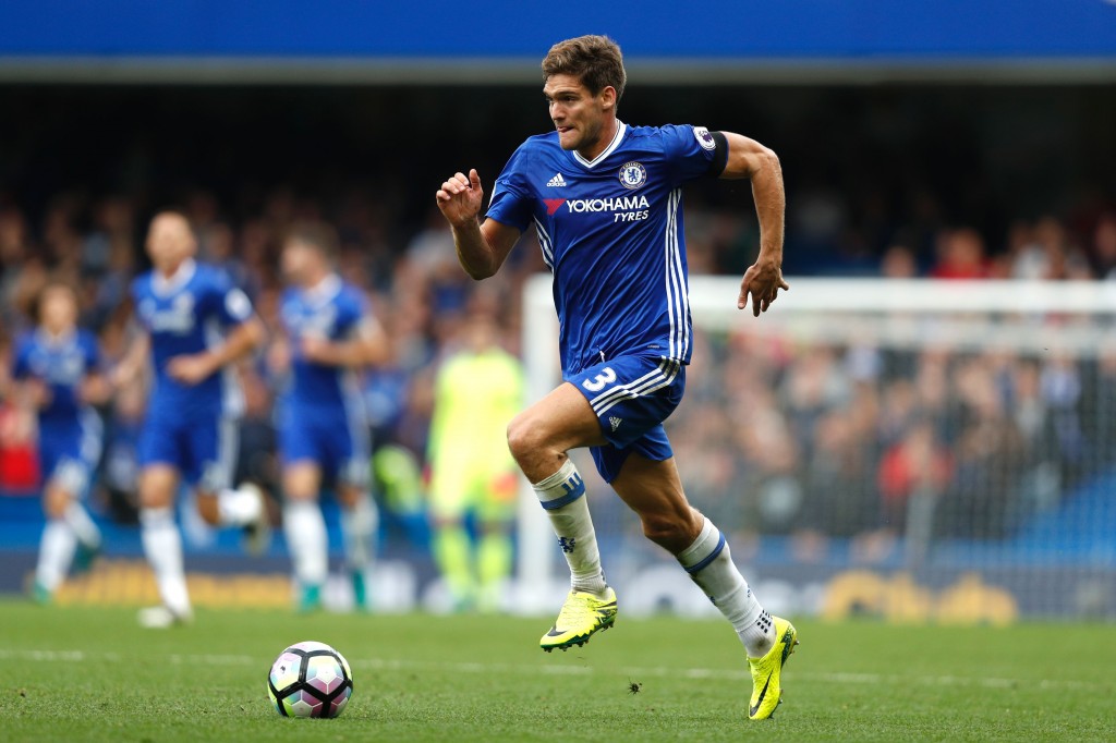 Chelsea's Spanish defender Marcos Alonso runs with the ball during the English Premier League football match between Chelsea and Leicester City at Stamford Bridge in London on October 15, 2016. (Photo by Adrian Dennis/AFP/Getty Images)