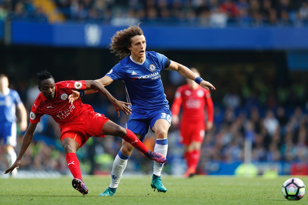Chelsea's Brazilian defender David Luiz (R) vies with Leicester City's Nigerian midfielder Ahmed Musa during the English Premier League football match between Chelsea and Leicester City at Stamford Bridge in London on October 15, 2016. (Photo by Adrian Dennis/AFP/Getty Images)