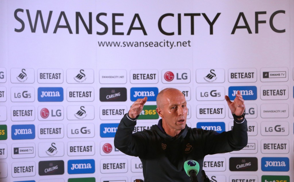 Premier League football club, Swansea City's new US manager Bob Bradley gestures as he hosts a press conference at the Marriot Hotel in Swansea, south wales on October 7, 2016. Swansea City hired former United States coach Bob Bradley as their new manager on Monday October 3, 2016 after the struggling Premier League club sacked Francesco Guidolin on his birthday. / AFP / Geoff CADDICK (Photo credit should read GEOFF CADDICK/AFP/Getty Images)