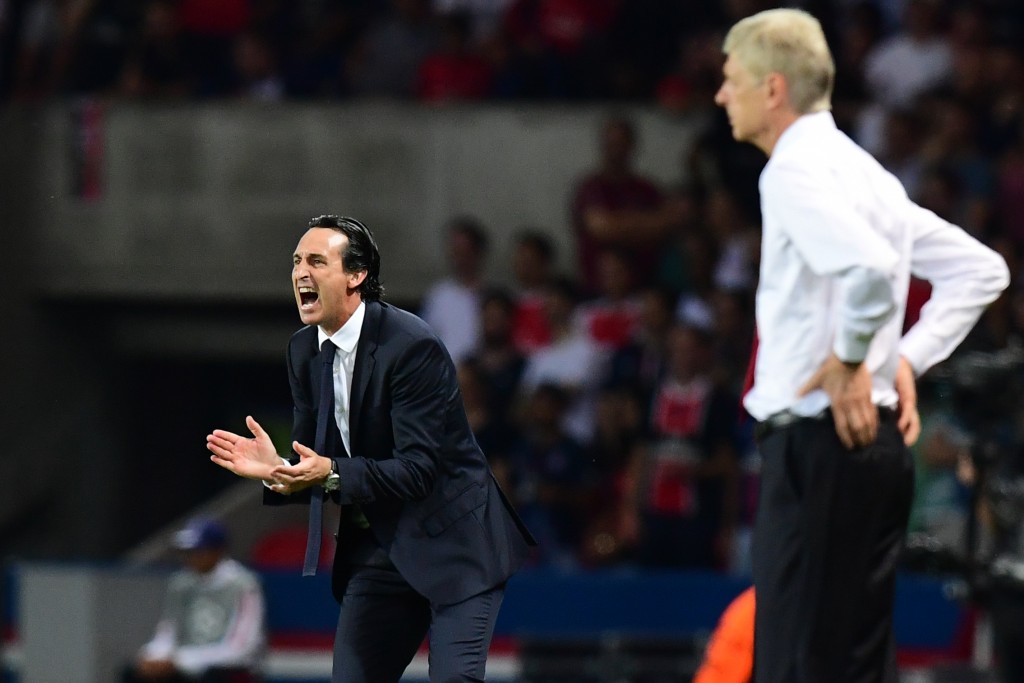 Paris Saint-Germain's Spanish head coach Unai Emery (L) gestures next to Arsenal's French manager Arsene Wenger during the UEFA Champions League Group A football match between Paris-Saint-Germain vs Arsenal FC, on September 13, 2016 at the Parc des Princes stadium in Paris. AFP PHOTO / FRANCK FIFE / AFP / FRANCK FIFE (Photo credit should read FRANCK FIFE/AFP/Getty Images)