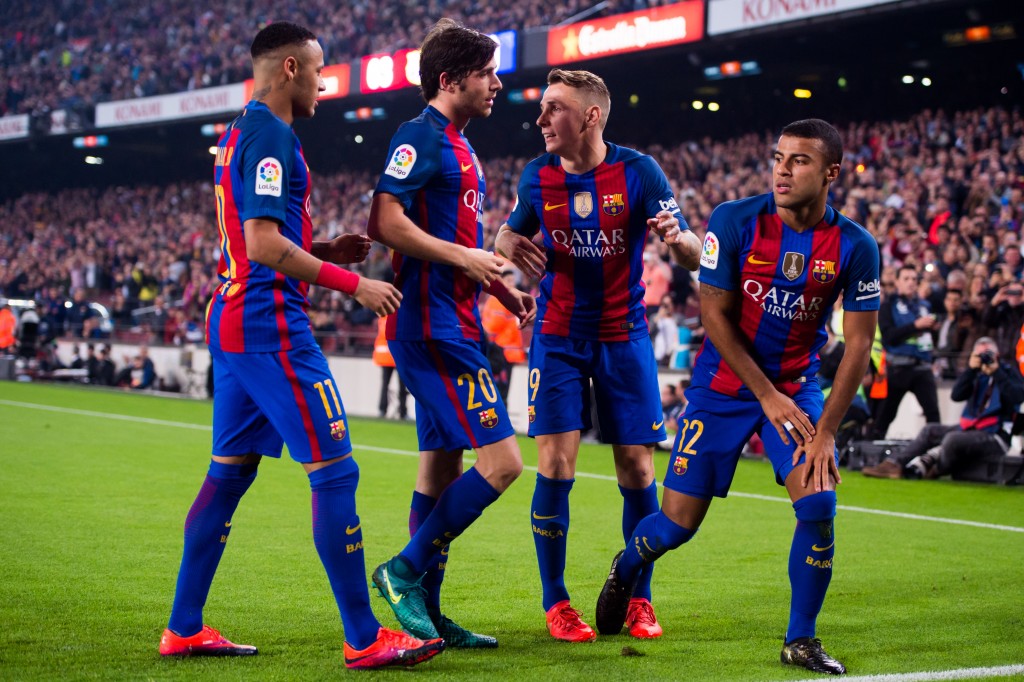 BARCELONA, SPAIN - OCTOBER 29: Rafinha (R) of FC Barcelona celebrates with his teammates Neymar Santos Jr (L), Sergi Roberto (2nd L) and Lucas Digne (2nd R) after scoring the opening goal during the La Liga match between FC Barcelona and Granada CF at Camp Nou stadium on October 29, 2016 in Barcelona, Spain. (Photo by Alex Caparros/Getty Images)