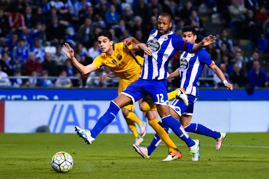LA CORUNA, SPAIN - APRIL 20: Marc Bartra of FC Barcelona scores his team's seventh goal past Sidnei Rechel da Silva of RC Deportivo La Coruna during the La Liga match between RC Deportivo La Coruna and FC Barcelona at Riazor Stadium on April 20, 2016 in La Coruna, Spain. (Photo by David Ramos/Getty Images)